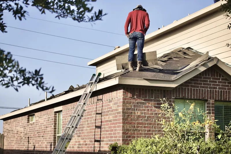 Professional roofer working on a residential roof in Hillcrest Estates